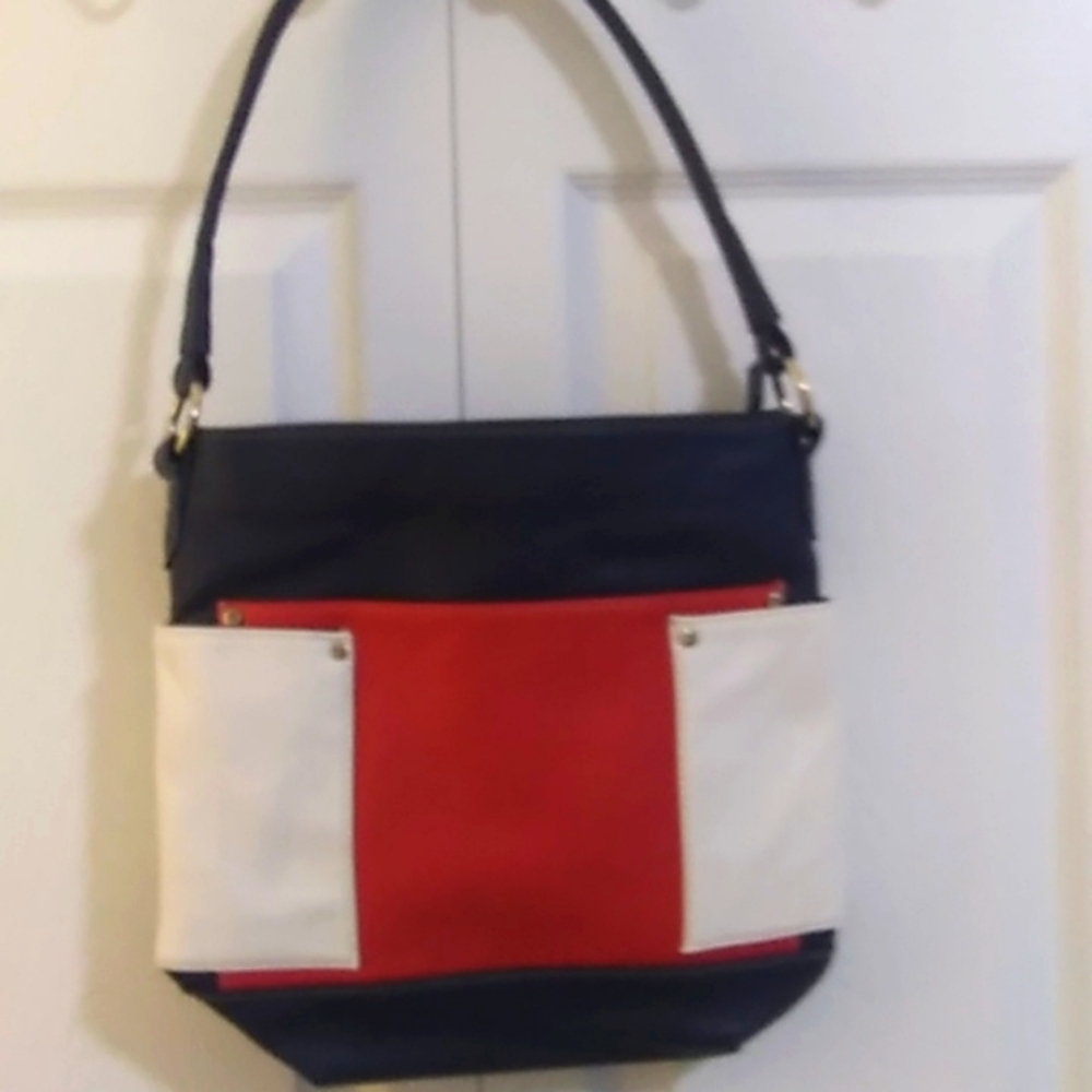 Red white navy. Leather handbag. Never used. 11in high 3.5 bottom 12 in wide.